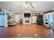 Spacious living room with hardwood floors and fireplace at 1215 Timberidge Dr, Lakeland, FL 33809