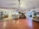 Spacious living room with hardwood floors and view into kitchen at 1215 Timberidge Dr, Lakeland, FL 33809
