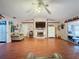Living room with hardwood floors, fireplace and lots of natural light at 1215 Timberidge Dr, Lakeland, FL 33809