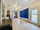 Sunroom features tiled floors and sliding glass doors at 1215 Timberidge Dr, Lakeland, FL 33809