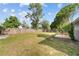 Backyard with patio, grass, and wooden fence at 14115 Newcomb Ave, Orlando, FL 32826