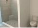 New bathroom featuring a toilet and a large shower at 1437 Arbor Hill Dr, Deltona, FL 32725