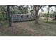 Mobile home with a surrounding yard and mature trees at 15924 Old Cheney Hwy, Orlando, FL 32833