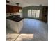 Combined kitchen and dining area with tile flooring and large window at 15924 Old Cheney Hwy, Orlando, FL 32833