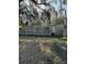 Mobile home with a wooden deck and surrounding trees at 15924 Old Cheney Hwy, Orlando, FL 32833