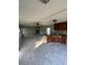 Open living area with tile flooring and access to the kitchen at 15924 Old Cheney Hwy, Orlando, FL 32833
