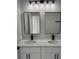 Double vanity with white cabinets and quartz countertops at 17026 Sw 36Th Ave, Ocala, FL 34473