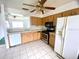 View of kitchen with wood cabinets and stainless steel appliances at 1816 Haperon St, Apopka, FL 32703