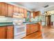 White appliances and wood cabinets in the kitchen at 234 Alpine St, Altamonte Springs, FL 32701