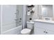 Clean bathroom with white vanity, shower/tub combo, and neutral decor at 2377 Penguin Blvd, Davenport, FL 33837