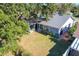 Aerial view of house, backyard, and surrounding trees at 2944 Curry Woods Dr, Orlando, FL 32822