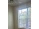 Well-lit bedroom with large window and ceiling fan at 3349 S Kirkman Rd # 1528, Orlando, FL 32811