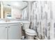 Clean bathroom with gray vanity and shower/tub combo at 4314 Prince Hall Blvd, Orlando, FL 32811