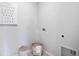 Bright laundry room with washer, dryer hookups, and storage at 441 Cinnamon Dr, Kissimmee, FL 34759