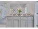 Modern bathroom with double vanity and granite countertop at 447 Caraway Dr, Kissimmee, FL 34759