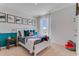 Comfy bedroom with a bed and shark theme decor at 447 Caraway Dr, Kissimmee, FL 34759