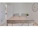Modern home office with a large desk, ample natural light, and stylish decor at 447 Caraway Dr, Kissimmee, FL 34759