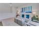 Cozy living room with sofa, ottomans, and natural light at 447 Caraway Dr, Kissimmee, FL 34759