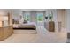 Bright main bedroom featuring a comfortable bed, large windows, and plenty of natural light at 447 Caraway Dr, Kissimmee, FL 34759