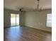 Living room with sliding glass doors leading to backyard at 4633 Glencrest Loop, Saint Cloud, FL 34772