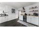 White shaker cabinets, built-in wine cooler, and wood shelving at 471 Bonifay Ave, Orlando, FL 32825