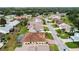 Aerial view of homes in a community with a focus on one house and its surroundings at 4731 Summerbridge Cir, Leesburg, FL 34748