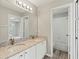 Bathroom with double vanity and granite countertop at 4731 Summerbridge Cir, Leesburg, FL 34748