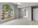 Bedroom with large window, mirrored closet doors, and carpet at 4731 Summerbridge Cir, Leesburg, FL 34748