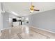 Spacious Gathering room with tile floors and ceiling fan at 4731 Summerbridge Cir, Leesburg, FL 34748