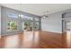 Spacious living area with hardwood floors and sliding doors to the patio at 4731 Summerbridge Cir, Leesburg, FL 34748