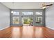 Spacious living area with hardwood floors and sliding doors to the patio at 4731 Summerbridge Cir, Leesburg, FL 34748