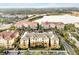 Aerial view of community, showcasing buildings and lake at 4814 Cayview Ave # 40613, Orlando, FL 32819