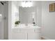 Modern bathroom with a double vanity and a large mirror at 4814 Cayview Ave # 40613, Orlando, FL 32819