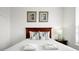 Bright bedroom with a double bed, nightstand, and artwork at 4814 Cayview Ave # 40613, Orlando, FL 32819