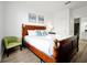 Bedroom with king-size bed, light wood furniture, and calming decor at 4814 Cayview Ave # 40613, Orlando, FL 32819