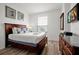 Bedroom with queen-size bed, dresser, and natural light at 4814 Cayview Ave # 40613, Orlando, FL 32819