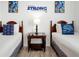 Twin bedroom with Star Wars decor and a nightstand at 4814 Cayview Ave # 40613, Orlando, FL 32819