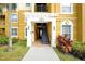 Condo building entrance with stairs and landscaping at 4814 Cayview Ave # 40613, Orlando, FL 32819