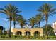 Resort entrance with palm trees and signage at 4814 Cayview Ave # 40613, Orlando, FL 32819
