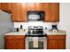 Kitchen with wood cabinets and stainless steel appliances at 4814 Cayview Ave # 40613, Orlando, FL 32819