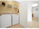Convenient laundry room with washer, dryer, and shelving at 4814 Cayview Ave # 40613, Orlando, FL 32819
