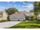 Two-story house with a two-car garage and a spacious backyard at 5910 Caymus Loop, Windermere, FL 34786