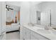 Double vanity bathroom with a view into a bedroom at 6115 Claystone Way, Mount Dora, FL 32757