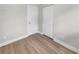 Empty bedroom with light gray walls and light wood flooring at 915 Golden Isle Dr, Mount Dora, FL 32757