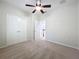 Large bedroom with ceiling fan, double doors and carpet flooring at 12706 Bideford Ave, Windermere, FL 34786