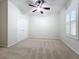 Bright bedroom with double doors and ceiling fan at 12706 Bideford Ave, Windermere, FL 34786