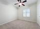 Bright bedroom with window and ceiling fan at 12706 Bideford Ave, Windermere, FL 34786