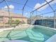 Relaxing screened pool with a stone bench at 12706 Bideford Ave, Windermere, FL 34786