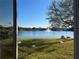 Lake view from inside the house, backyard with birds at 14112 Morning Frost Dr, Orlando, FL 32828