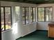 Bright sunroom with multiple windows and access to backyard at 157 Arthur St, Altamonte Springs, FL 32701